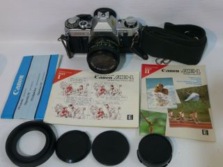 Canon Ae - 1 35mm Slr Film Camera W/ Canon Fd 50 Mm 1:1.  8 Lens & Manuals Ex
