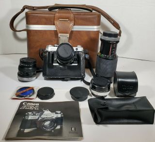 Canon Ae - 1 Camera,  5 Lenses,  Deluxe Slr Leather Case,  Instructions