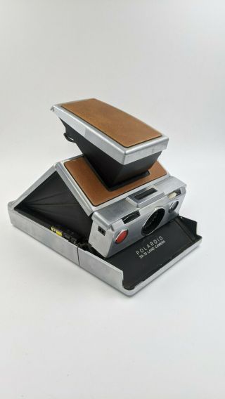 Vintage Polaroid SX - 70 with flash,  case and docs.  and.  B&W film inc 3