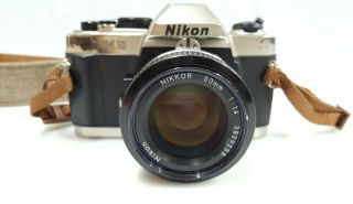 Nikon Fm10 35mm Slr Film Camera W/ 50mm F/1.  4 Nikon Nikkor Lens And Neck Strap