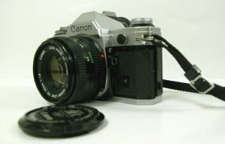CANON AE - 1 35mm FILM CAMERA & CANON FD 50 mm f 1.  8 LENS. 2