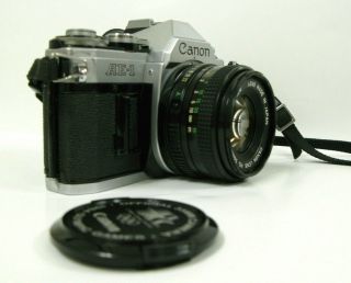 CANON AE - 1 35mm FILM CAMERA & CANON FD 50 mm f 1.  8 LENS. 3
