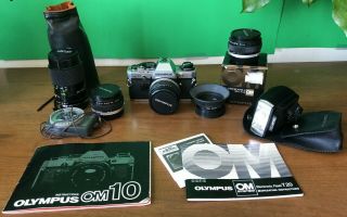 Olympus Om10,  Lenses (28,  35,  50 And 85,  135 Mm) And Accessories