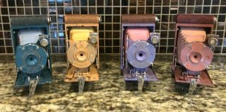 Two Petites And Two Vest Pocket Hawkeye Kodak Cameras
