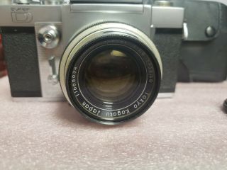 Beseler Topcon D with Topcor 5.  8cm f1.  8 lens.  Topcon Uni with Topcon lens 2