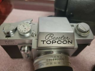 Beseler Topcon D with Topcor 5.  8cm f1.  8 lens.  Topcon Uni with Topcon lens 3