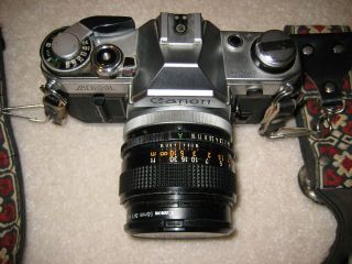 Canon Ae - 1 35 Mm Slr Camera And Accessories.