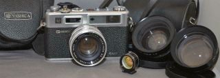 G Yashica Electro 35 Gsn Rangefinder Camera W/ 1.  7/45,  Aux.  Lenses [sk]