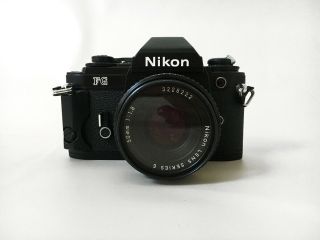 Nikon Fg 35mm Film Camera With 1:1.  8 Nikon E Series Lens Black
