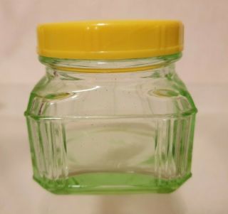 VINTAGE URANIUM GREEN DEPRESSION GLASS STORAGE JAR YELLOW PLASTIC LID 6.  5cm 2