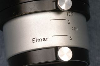 ERNST LEITZ FIKUS 5 - 13.  5CM ADJUSTABLE METAL CLAMP - ON LENS HOOD FOR ELMAR LENSES 2
