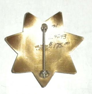 vintage brass STOVALL ' S security service BADGE made by SUN BADGE CO.  LA 2
