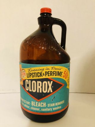 Vintage 1960’s Clorox Amber Glass Bottle Jug With Lid.  Evening In Paris Label.