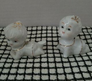 Vintage Pair Porcelain Crawling Piano Baby Figurines