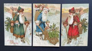 Vintage Santa Postcards (3) Green,  Blue,  Red Robes,  Toy Baskets,  Wheelbarrow