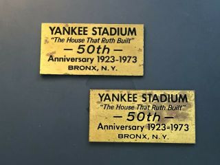 Two Yankee Stadium 50th Anniversary Brass Seat Plaques