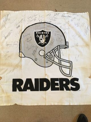 Mid 1980’s Oakland Raiders Team Flag Signed By Players.