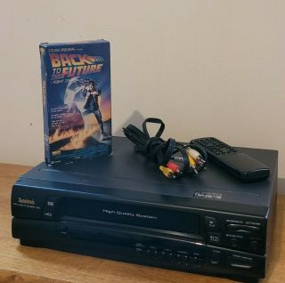 Symphonic Model 6480 Vcr W/ Remote,  Audio Video Cables And Vhs