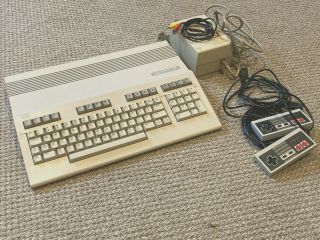 Commodore 128 Computer With Jiffydos,  Power Supply,  And Joysticks,  Monitor Cable