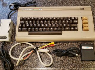 Commodore 64 Computer With Power Supply,  Cables,  And Gorf Game Cartridge