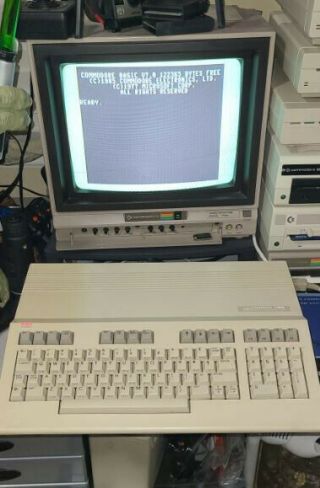 Commodore 128 Computer With Power Supply And Manuals.