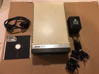ATARI DISK DRIVE 1050 WITH DOS 3.  0 DISKETTE POWERS ON 2