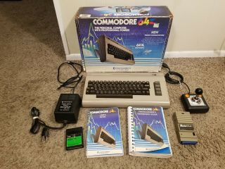 Commodore 64 Personal Computer With Manuals Joystick,  Modem Fully