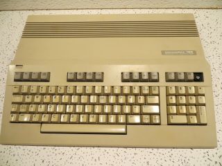Commodore 128 Personal Computer With Power Supply And Guide