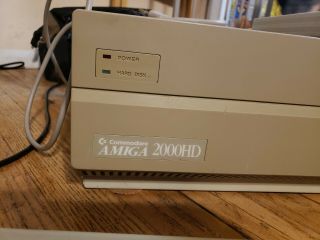 Commodore Amiga 2000 w/ mouse,  keyboard,  books,  disks,  external drives 3