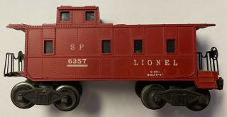 Lionel 6357 Caboose.  Maroon W/light.  Front And Rear Brake Wheels.