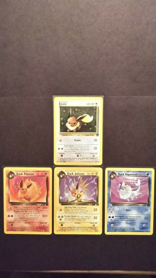 Eevee,  Dark Flareon,  Jolteon,  Vaporeon Team Rocket Set Of Vintage Pokemon Cards