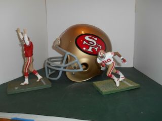 San Francisco 49er ' s Riddell Helmet,  McFarlane Figures - Joe Montana,  Jerry Rice 2