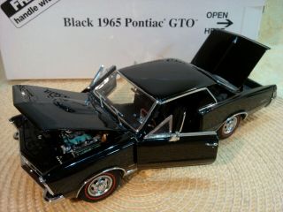 DANBURY 1965 PONTIAC GTO.  RARE BLACK COUPE.  1:24.  NIB.  DOCS.  UNDISPLAYED 4