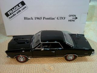 DANBURY 1965 PONTIAC GTO.  RARE BLACK COUPE.  1:24.  NIB.  DOCS.  UNDISPLAYED 6