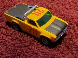 AURORA AFX DATSUN BAJA TRUCK 1745 YELLOW w/ RED 211 Slot Car HO Number in case 3