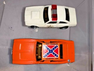 VINTAGE IDEAL DUKES OF HAZZARD SLOT CARS GENERAL LEE AND POLICE CAR RUNS LIGHTS 2