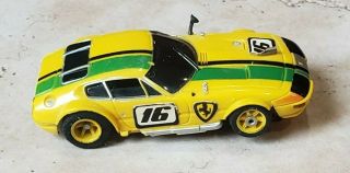 Aurora Afx | 16 Ferrari Daytona Coupe | Yellow/green | 1736 | Slot Car