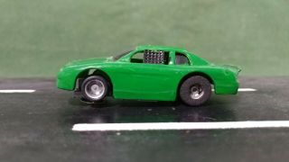 Green Tyco 1:64 Scale Chevy Monte Carlo Stock Slot Car