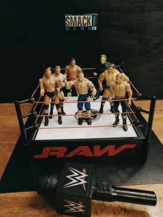 Wwe Raw Spring Loaded Wrestling Ring Bundle With 7 Figures And Microphone
