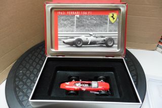 Ferrari 1/43 Hot Wheels Ixo John Surtees 156 F1 Embossed Ferrari Logo Tin Boxed