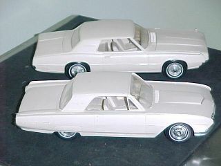 2 White Thunderbirds,  1962 And 1967 Dealership Promo Cars.