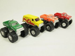 Road Champs 1987 Monster Trucks - Hi Rollers,  Red Bouncer,  4 X 4,  Fire Cat Van