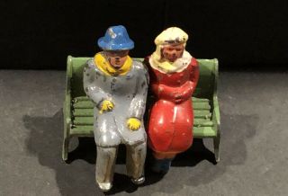 (1) Set Of Lead Barclays/dime Store Winter Figures Couple Sitting On Bench B