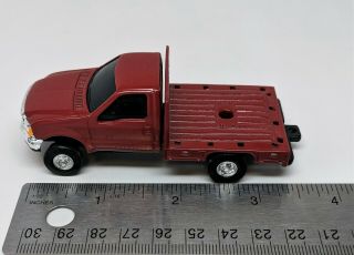 Ertl - Red Ford F - 350 Flatbed Dually Pickup Truck - 1:64 Scale (loose)