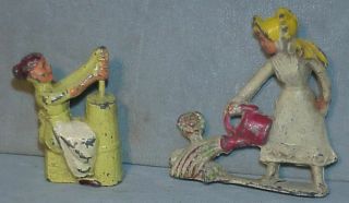 Two Vintage Manoil Lead Toy Figure Girl Watering Flowers & Woman At Butter Churn