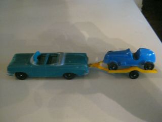 Tootsietoy Oldsmobile Convertible With Trailer And Race Car.