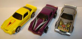 Hot Wheels Yellow Chevrolet Camaro Z28,  Mad Max Z28,  Purple Z28