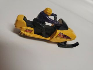 Mattel MATCHBOX 1999 Snowmobile,  Yellow Body,  Black Seat,  Purple Rider 2