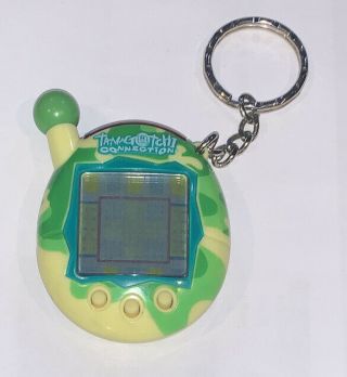 Tamagotchi Connection V4.  5 Yellow Green Electronic Game Keychain Ring Camo