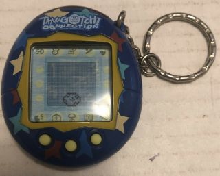 2004 Bandai Tamagotchi Connection Blue Yellow Stars Battery Virtual Pet